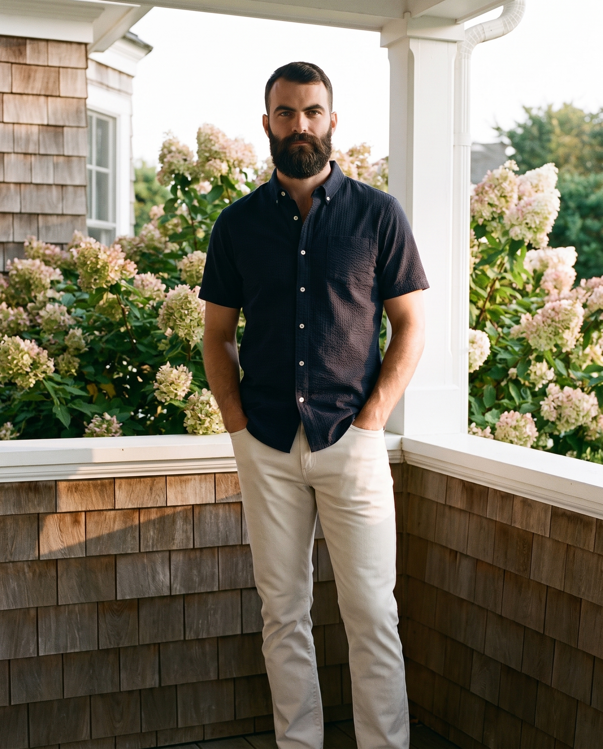 7 Diamonds Baron 5-Pocket Pant in Bone on a Hamptons shingle-style porch