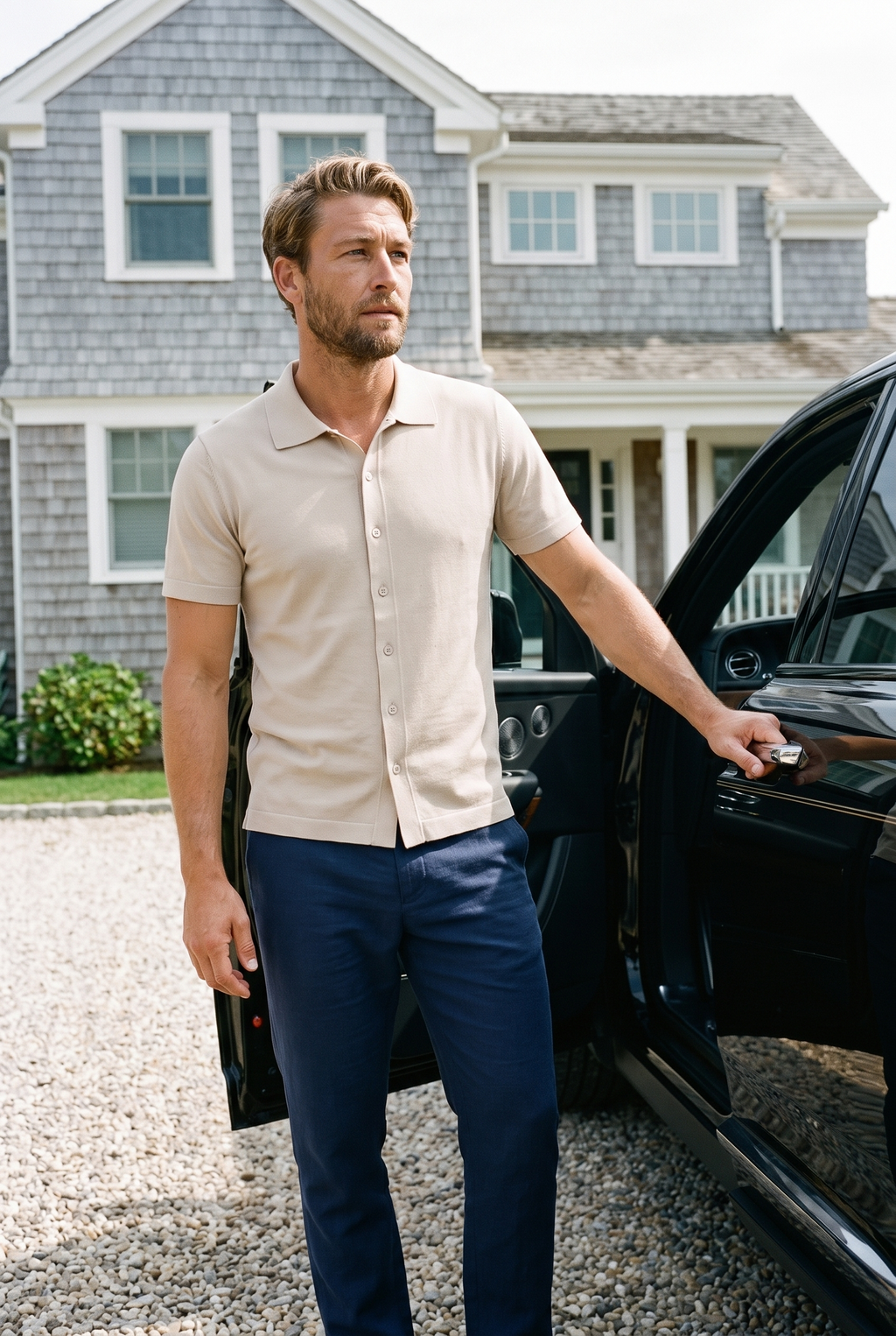 Cuts Riviera Knit Button Up in Sand Dune, worn at a Hamptons estate with a Rolls-Royce