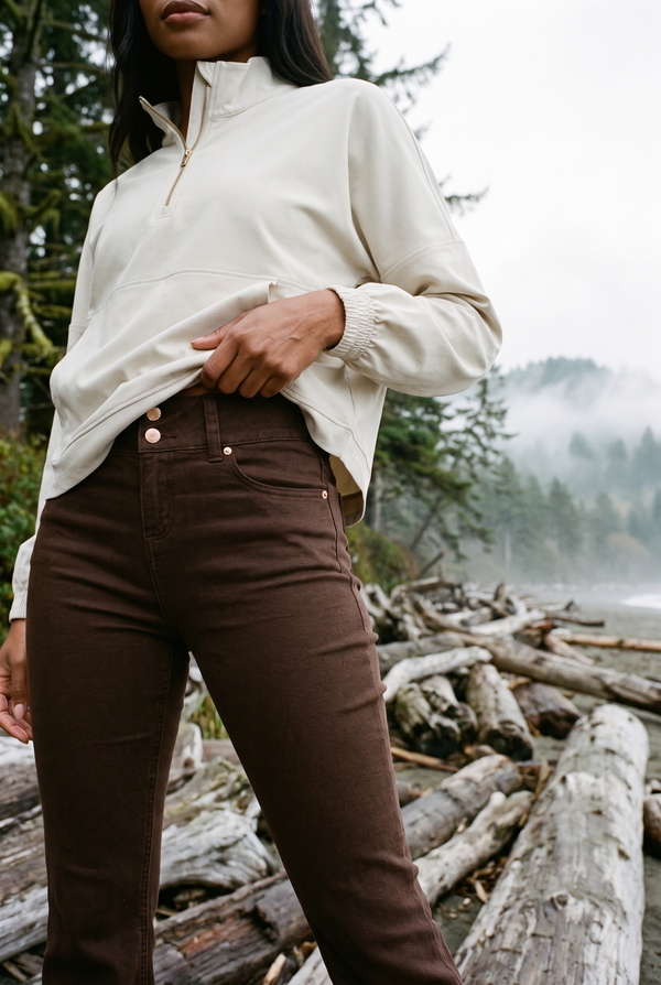 1822 Denim 30" Shapewear Fit & Lift Flare Jean in Espresso with the Rhone Mirage Anorak in Sand, Pacific Northwest driftwood beach